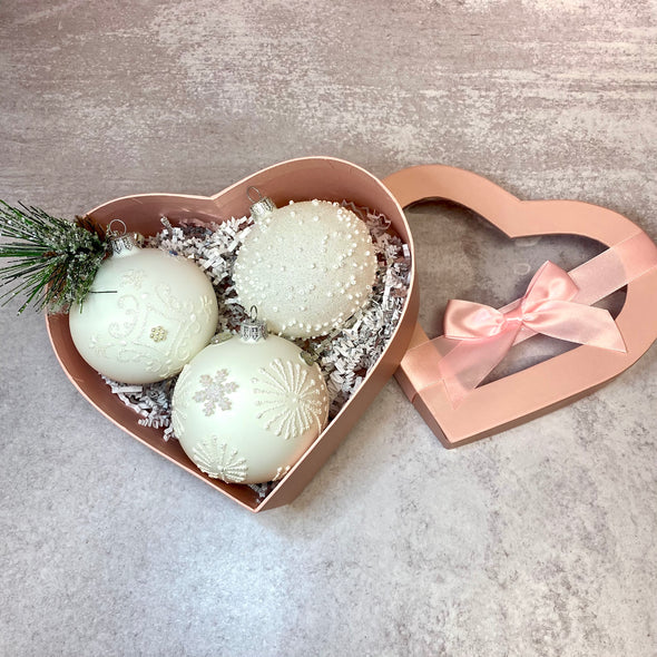 THREE ADORNED CHRISTMAS ORNAMENTS IN HEART SHAPED GIFT BOX